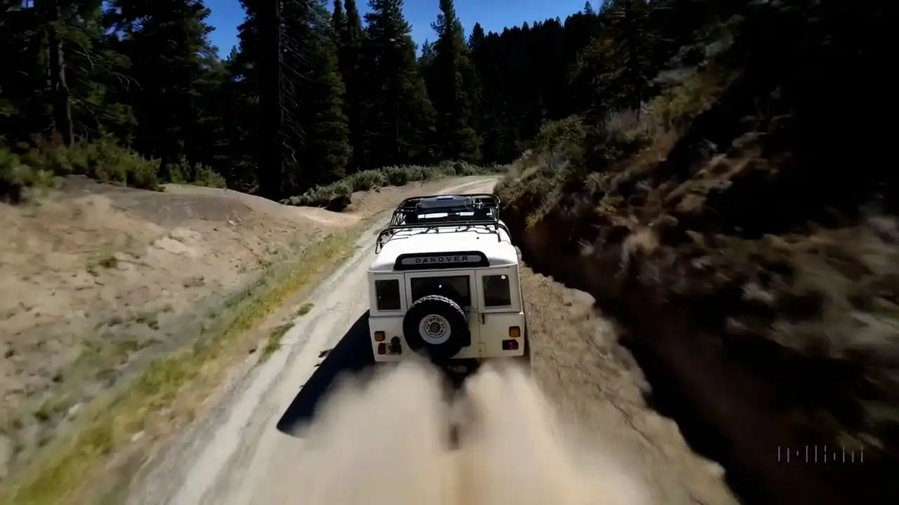 Thumbnail ofThe camera follows behind a white vintage SUV's video