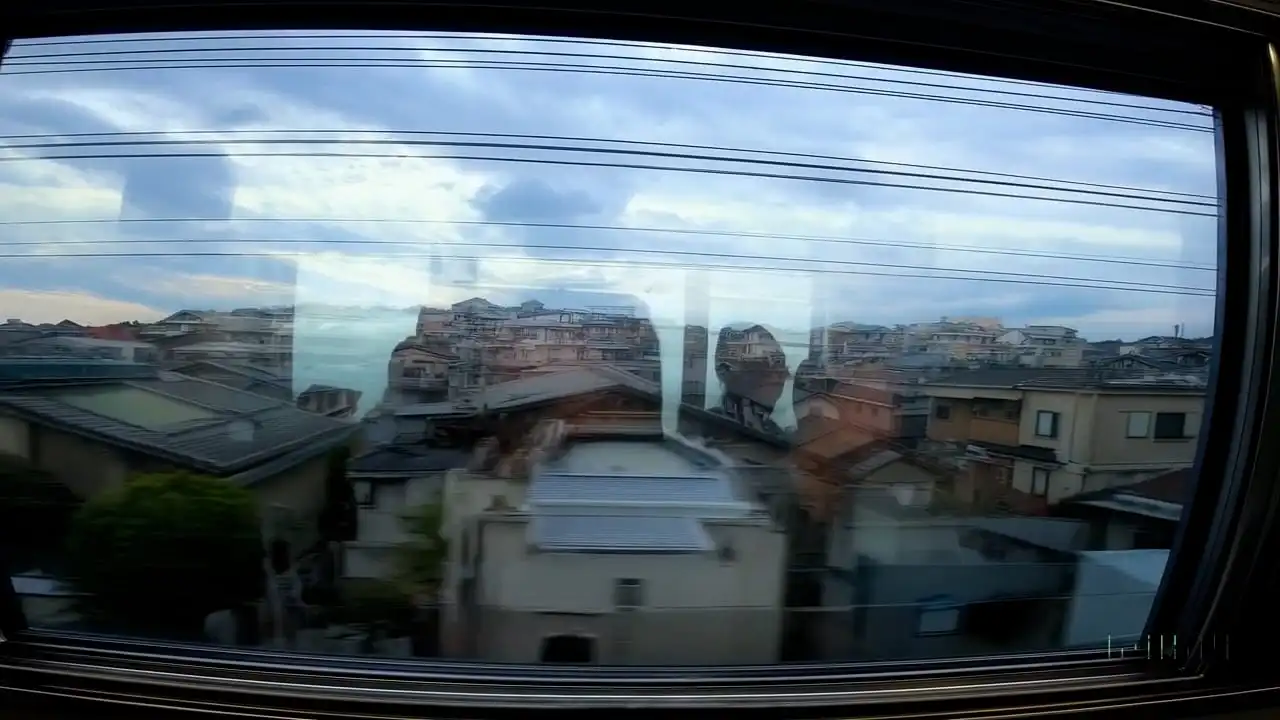 Thumbnail ofReflections in the window of a train traveling through the Tokyo suburbs's video